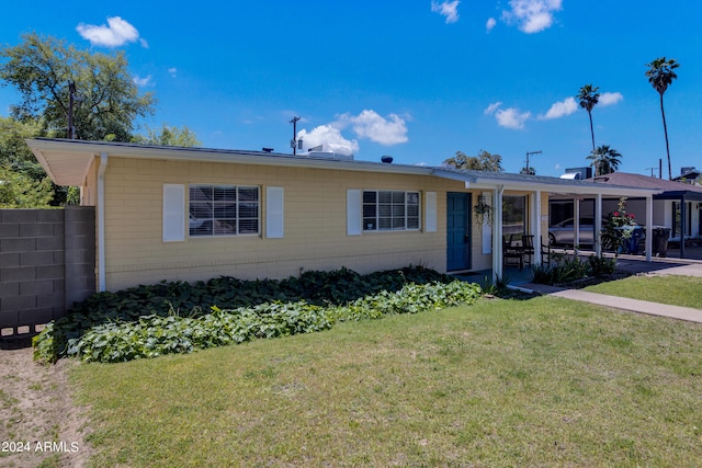 ranch-style house with a front lawn