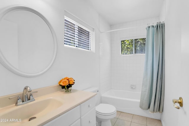 full bathroom with toilet, shower / bath combo with shower curtain, tile patterned floors, and vanity