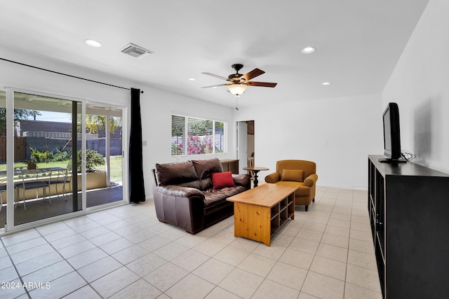 tiled living room with ceiling fan