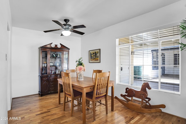 dining space featuring ceiling fan and hardwood / wood-style flooring