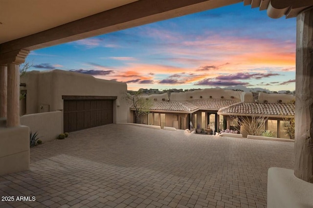 exterior space with decorative driveway