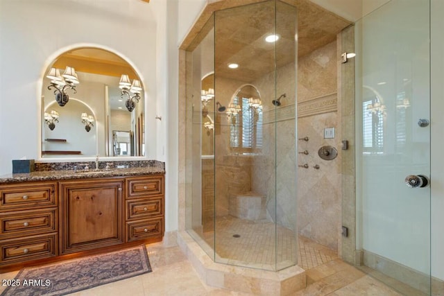 bathroom with a shower stall, vanity, and tile patterned floors