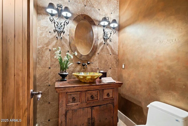 bathroom featuring vanity and toilet