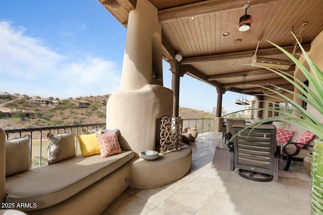 view of patio featuring a balcony and outdoor lounge area