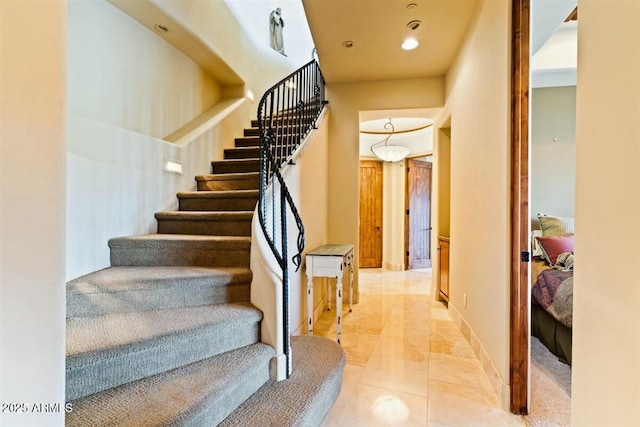 stairs featuring recessed lighting, tile patterned flooring, and baseboards