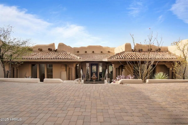 rear view of property with a patio area