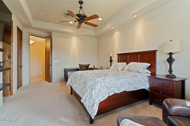 bedroom with visible vents, a raised ceiling, a ceiling fan, light colored carpet, and recessed lighting