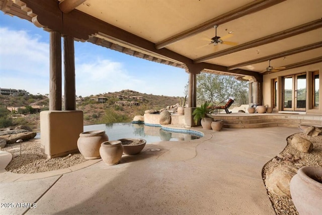 view of patio / terrace with ceiling fan and french doors