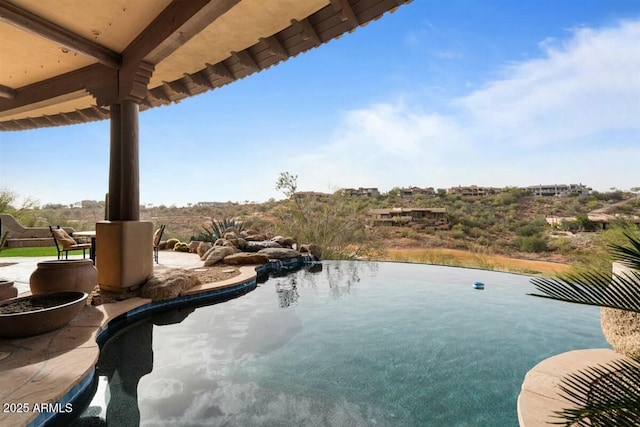 view of pool featuring a patio area