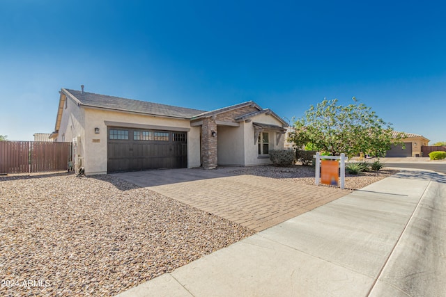 single story home featuring a garage