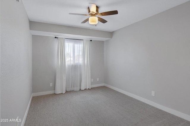 empty room with light carpet and ceiling fan