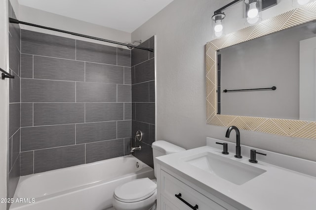 full bathroom with vanity, toilet, and tiled shower / bath combo