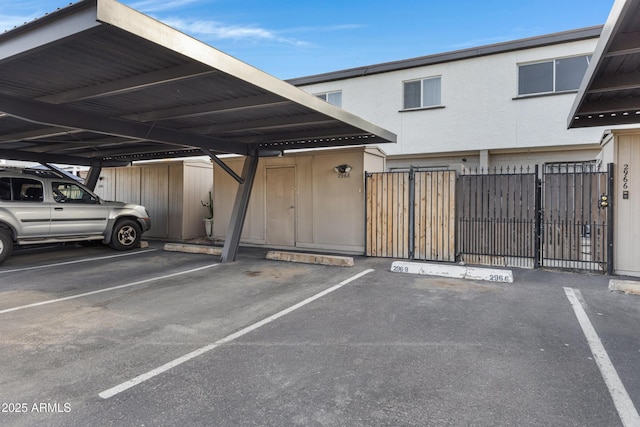 view of vehicle parking with a carport