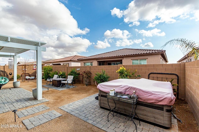 view of patio / terrace featuring a hot tub