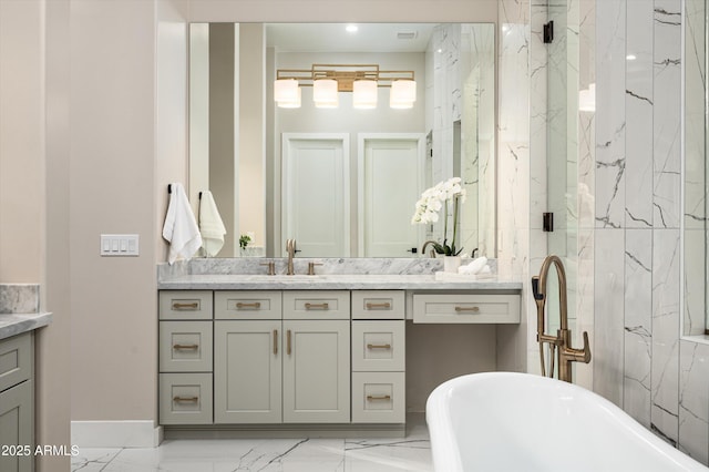bathroom with marble finish flooring, vanity, a soaking tub, and a marble finish shower
