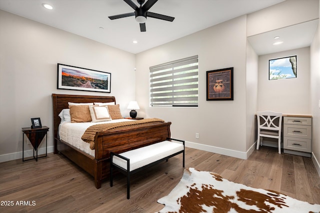 bedroom with light wood-type flooring, baseboards, recessed lighting, and a ceiling fan