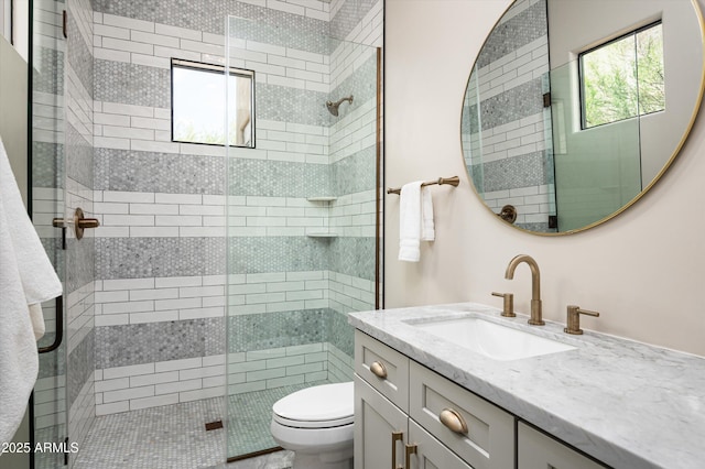 full bath with toilet, a shower stall, and vanity