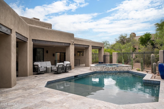 view of pool featuring a patio area, fence, an outdoor living space, and a pool with connected hot tub