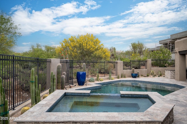 view of swimming pool with fence and a pool with connected hot tub