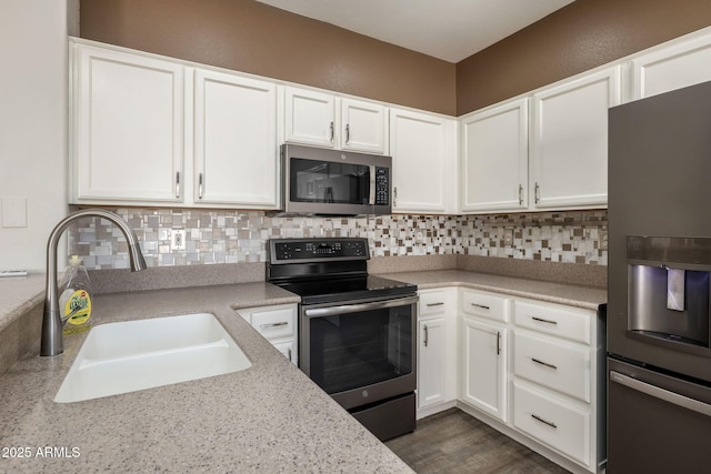 kitchen featuring sink, white cabinetry, and stainless steel appliances