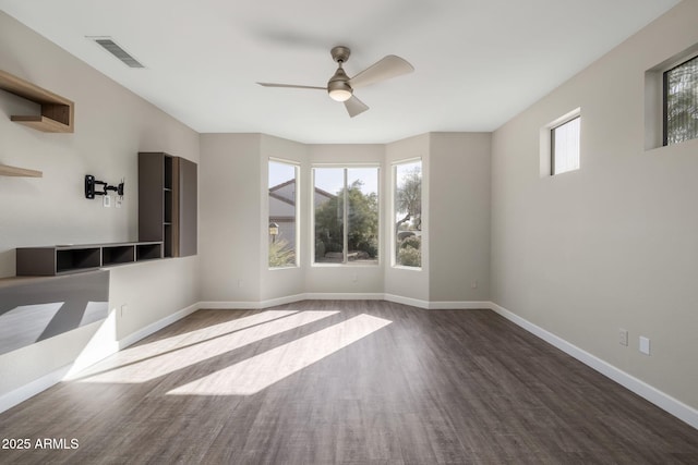 unfurnished room with hardwood / wood-style floors and ceiling fan