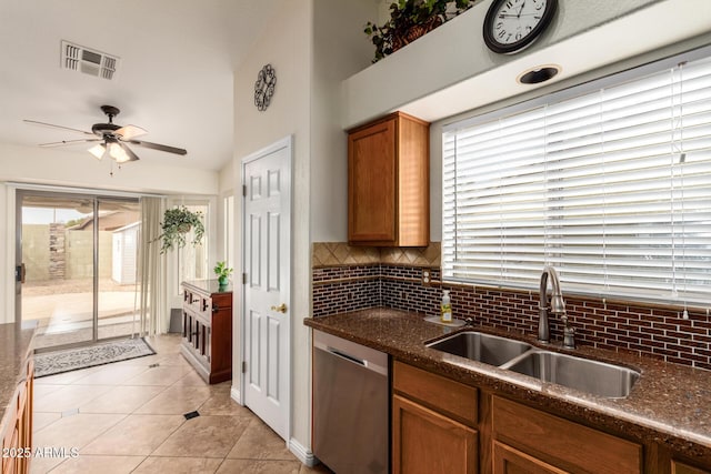 11318 S Hopi Dr, Goodyear, AZ 85338 - kitchen featuring a sink, dishwasher, tasteful backsplash, ceiling fan, and light tile patterned flooring