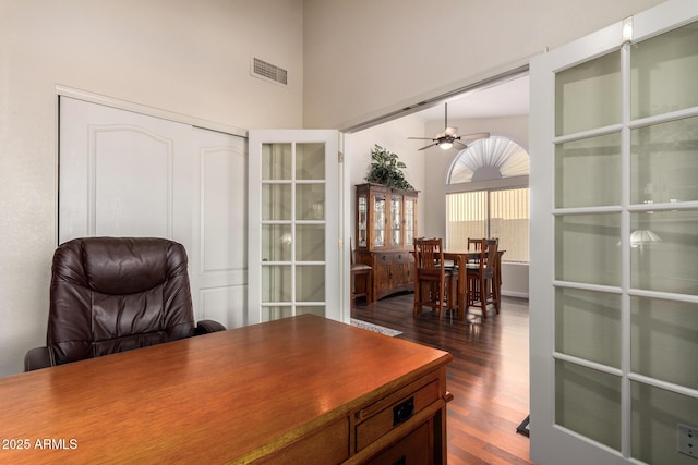 11318 S Hopi Dr, Goodyear, AZ 85338 - office with dark wood finished floors, a towering ceiling, and ceiling fan