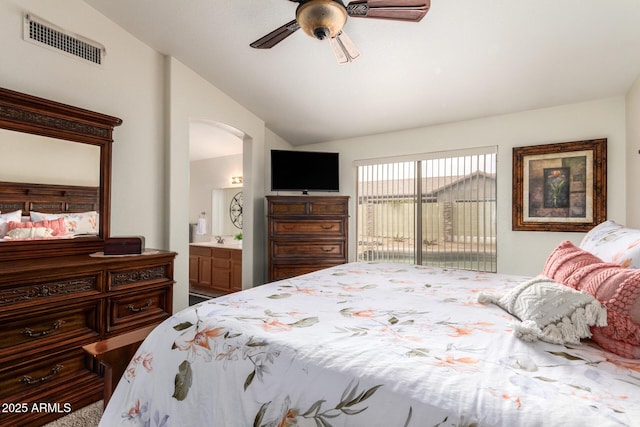 11318 S Hopi Dr, Goodyear, AZ 85338 - bedroom featuring lofted ceiling, arched walkways, access to outside, connected bathroom, and a ceiling fan
