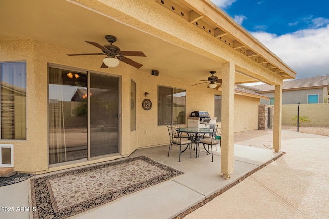 11318 S Hopi Dr, Goodyear, AZ 85338 - view of patio with ceiling fan, fence, outdoor dining area, and area for grilling