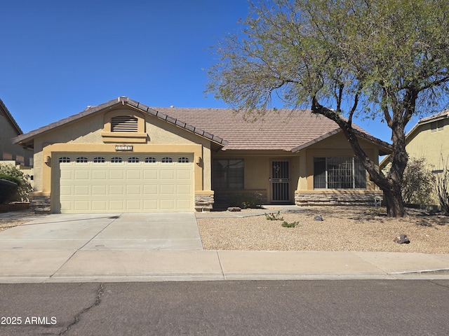 11318 S Hopi Dr, Goodyear, AZ 85338 - ranch-style house featuring stucco siding, concrete driveway, stone siding, a garage, and a tile roof