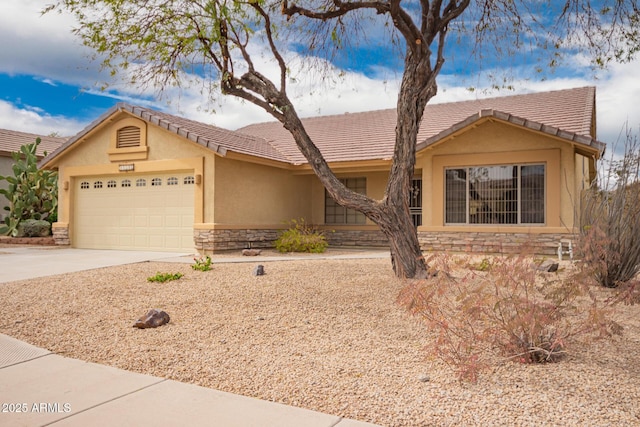11318 S Hopi Dr, Goodyear, AZ 85338 - single story home with stone siding, stucco siding, a garage, and concrete driveway