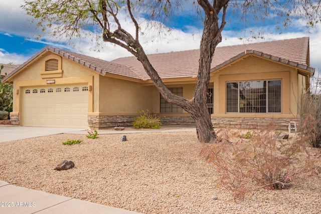 11318 S Hopi Dr, Goodyear, AZ 85338 - single story home with stone siding, stucco siding, driveway, and an attached garage