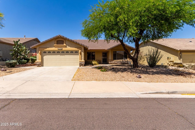 11318 S Hopi Dr, Goodyear, AZ 85338 - single story home featuring stucco siding, a garage, driveway, and a tile roof