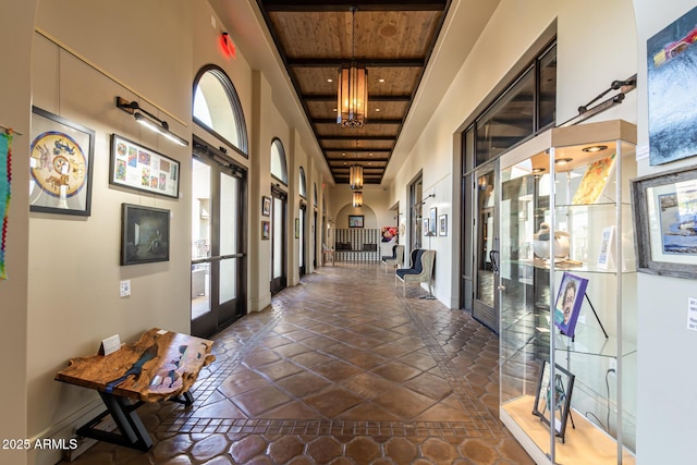 11318 S Hopi Dr, Goodyear, AZ 85338 - hall featuring a high ceiling, wooden ceiling, and french doors