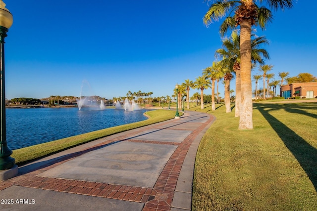 11318 S Hopi Dr, Goodyear, AZ 85338 - view of community with a water view and a lawn