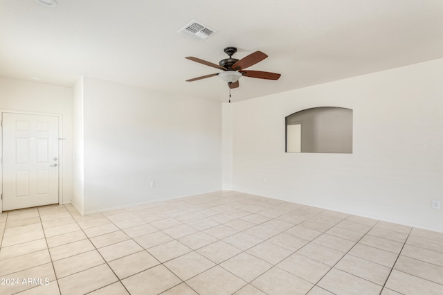 unfurnished room with light tile patterned flooring and ceiling fan