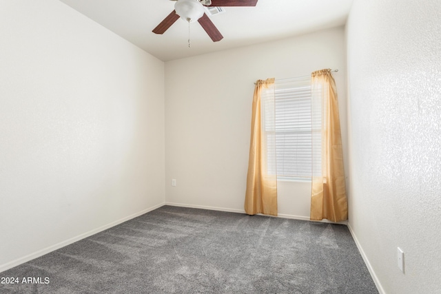 carpeted spare room featuring a ceiling fan, baseboards, and visible vents