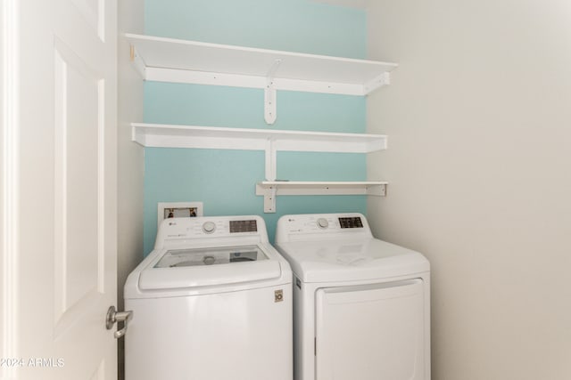 laundry room with separate washer and dryer