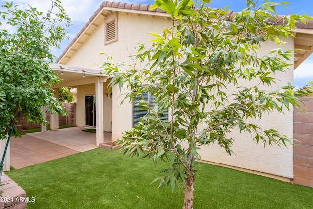 view of yard featuring a patio and fence