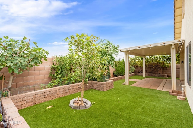 view of yard featuring a patio and a fenced backyard