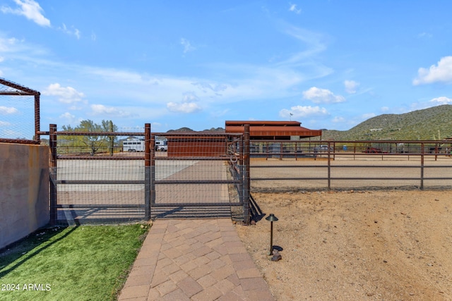 view of gate featuring a mountain view