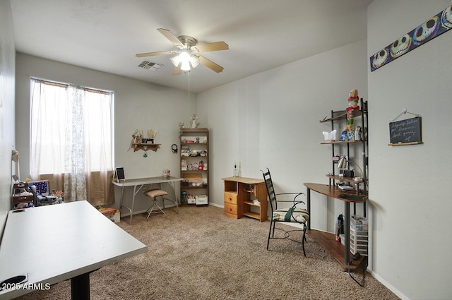 carpeted office space with ceiling fan