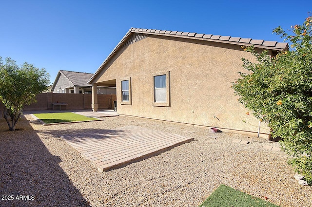 back of house with a patio