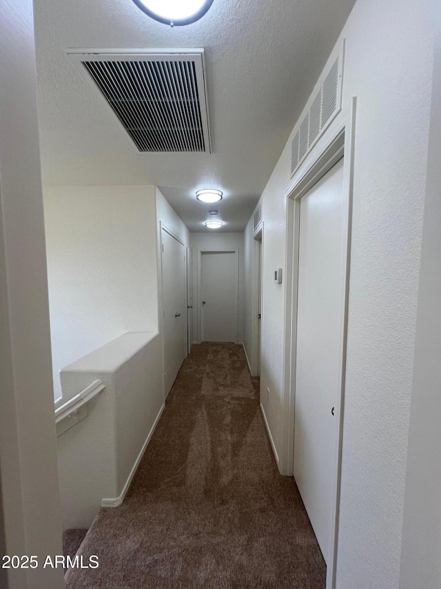 hallway with carpet flooring