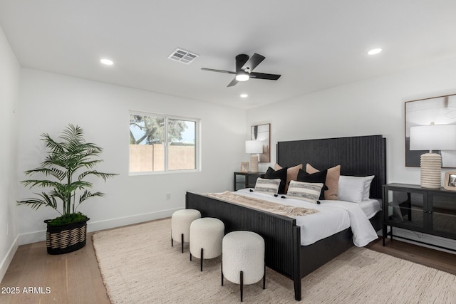 bedroom featuring hardwood / wood-style floors and ceiling fan