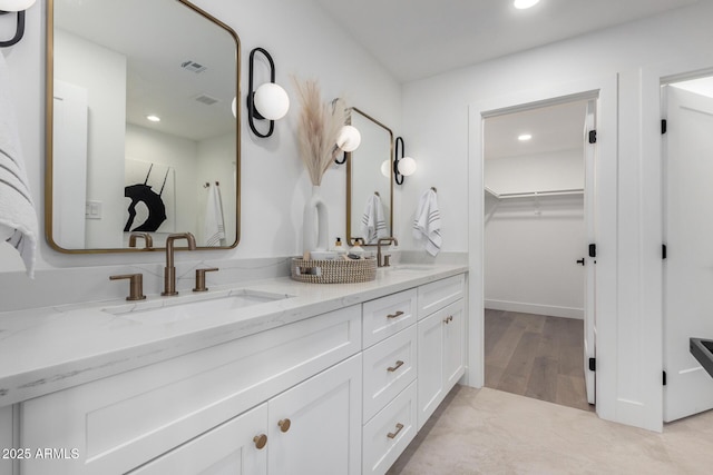 bathroom featuring vanity and hardwood / wood-style flooring