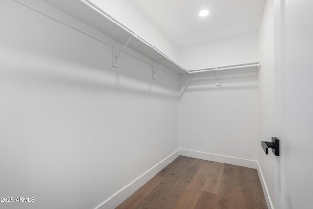 walk in closet featuring hardwood / wood-style floors