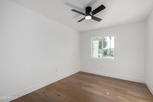 empty room featuring wood-type flooring and ceiling fan