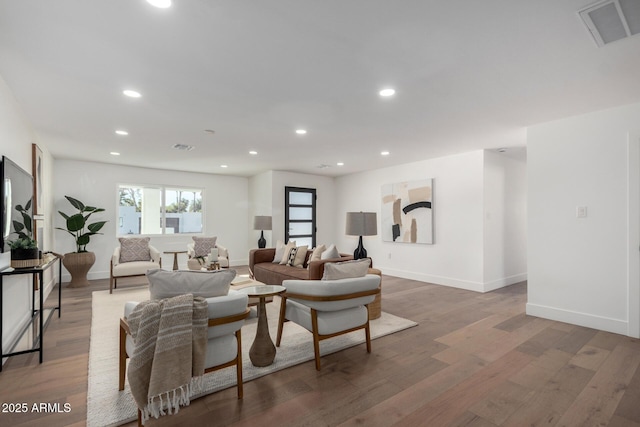 living room with dark hardwood / wood-style floors