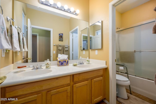 10242 E Pantera Ave, Mesa, AZ 85212 - bathroom featuring toilet, double vanity, and shower / bath combination with glass door